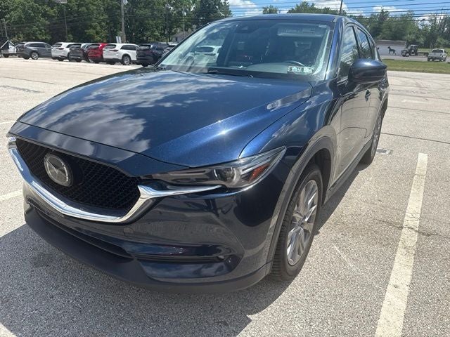 2020 Mazda Mazda CX-5 Grand Touring in Deep Crystal Blue Mica — front three-quarter view